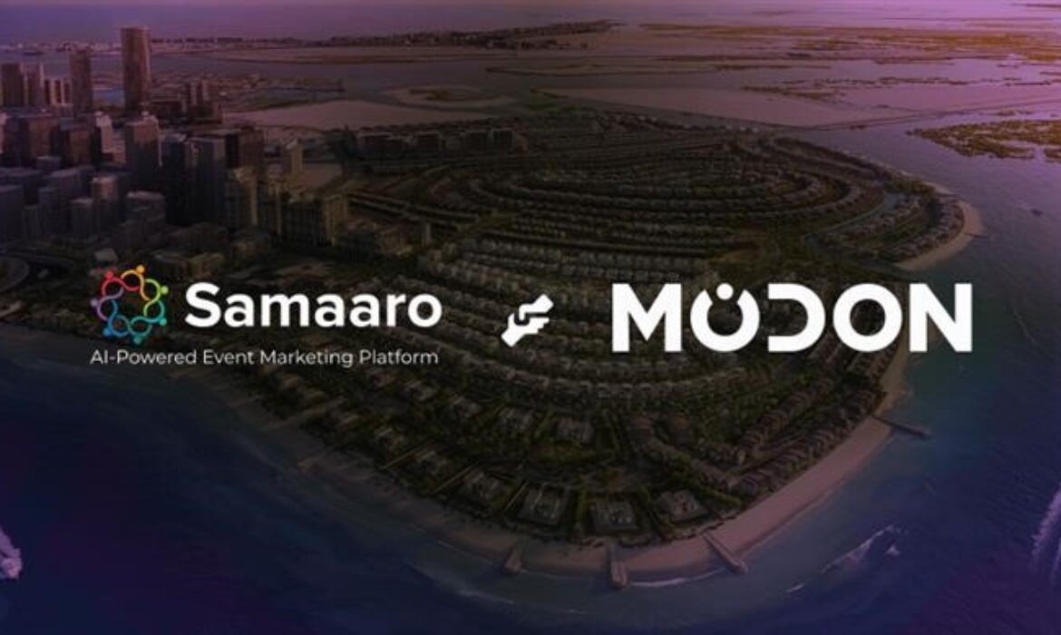 Aerial view of a coastal city at dusk with logos for Samaaro and MODON on top.